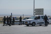 Israeli police stand guard near the site of a <a href=