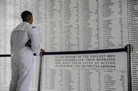 Yeoman 2nd Class Christopher Buco, assigned to the ‘Golden Eagles’ of Patrol Squadron (VP) 9, reads the list of fallen military members following colors onboard the USS Arizona Memorial in Pearl Harbor, Hawaii.