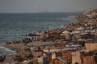 Tents are crammed together along the beach of Deir al-Balah.