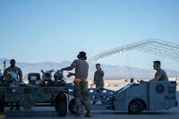 U.S. Air Force maintenance unit load munitions onto a jammer