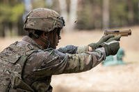 A soldier fires a SIG Sauer M17 striker-fired pistol during a weapons qualification at Drawsko Pomorskie, Poland.