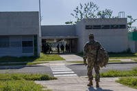 U.S. Army Reserve Officer Training Corps instructor arrives at the ROTC building on a university campus