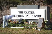flowers at the entrance to The Jimmy Carter Presidential Center in Atlanta