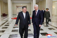 North Korean leader Kim Jong Un, left, meets Russian Defense Minister Andrei Belousov