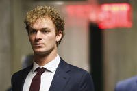 Daniel Penny walks towards the courtroom