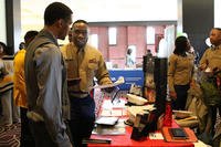 Sgt. Devon McIntyre, Marine Corps Recruiting Station Baton Rouge officer selection assistant, speaks to a prospect during the Bayou Classic career fair at the Hyatt Regency Hotel New Orleans.