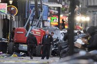 Security personnel investigate the scene on Bourbon Street after a vehicle drove into a crowd on New Orleans' Canal and Bourbon Street
