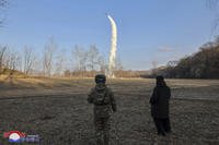 North Korean leader Kim Jong Un inspects testing of sea-to-surface strategic cruise guided weapons.