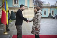 Ukrainian President Volodymyr Zelenskyy shakes hands with President of Moldova Maia Sandu