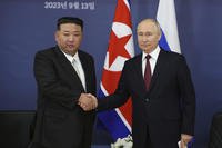 Russian President Vladimir Putin, right, and North Korean leader Kim Jong Un