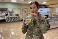 U.S. Army Capt. Caitlyn Shaver, chief of clinical nutrition at Blanchfield Army Community Hospital at Fort Campbell, Kentucky, drinks water throughout the day to help maintain optimal hydration.