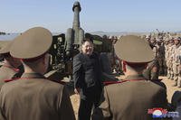 Kim Jong Un visits an artillery exercise at an undisclosed place in North Korea.