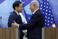 U.S. Secretary of State Marco Rubio and Israeli Prime Minister Benjamin Netanyahu shake hands