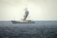 Smoke rising from a fire aboard the Russian spy ship Kildin off the coast of Syria.