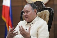 Philippine Defense Secretary Gilberto Teodoro gestures