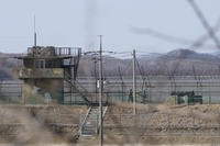 South Korean army soldiers patrol along the barbed-wire fence in Paju, South Korea