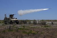 A U.S. Marine Air Defense Integrated System fires at a drone.
