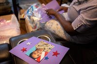 Oneida Oliver-Sanders, mother of Army Reserve Sgt. Kennedy L. Sanders, makes Memorial Day craft packages for elementary school students at her home in Waycross, Georgia.