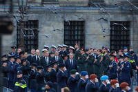 Dutch King Willem-Alexander and Queen Maxima arrive to lay a wreath during a solemn annual national service.