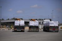 Trucks carrying humanitarian aid for the Gaza Strip are seen at the Kerem Shalom Crossing in southern Israel