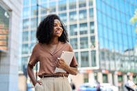 A woman walks around a college campus