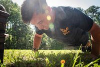 Hospital Corpsman Third Class Dru Calloway conducts push-ups aboard Marine Corps Air Station Cherry Point, North Carolina.