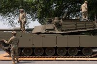U.S. Army soldiers work on an M1 Abrams tank staged in West Potomac Park ahead of an upcoming military parade commemorating the Army's 250th anniversary and coinciding with Donald Trump's 79th birthday.