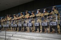 California National Guard stand in formation guarding the federal building in downtown Los Angeles