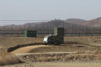 A South Korean military vehicle with loudspeakers is seen in front of the barbed-wire fence in Paju