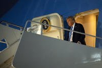 President Donald Trump steps off Air Force One after at Joint Base Andrews