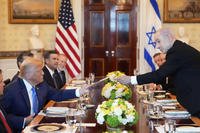 Israel's Prime Minister Netanyahu hands President Trump a folder