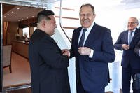 Russian Foreign Minister Sergey Lavrov shakes hands with North Korea's leader Kim Jong Un