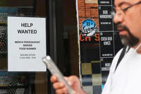 A help-wanted sign is displayed at a live music and blues club in Chicago.
