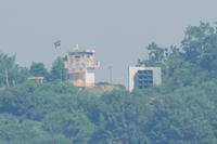 A North Korean military guard post, left, and loudspeaker are seen from Paju, South Korea