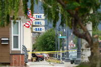 Police tape surrounds The Owl Bar in Anaconda, Montana.