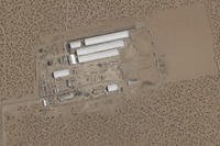 construction of large white tents for a new immigrant detention center at Fort Bliss