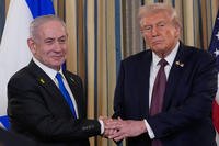 Israel Prime Minister Benjamin Netanyahu shakes hands with President Donald Trump.