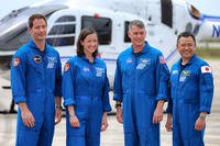 From left, European Space Agency astronaut Thomas Pesquet, NASA astronauts Megan McArthur and Shane Kimbrough, and Japanese astronaut Akihiko Hoshide pose for a photo after arriving at Kennedy Space Center, Florida, Friday, April 16, 2021, ahead of the SpaceX Crew-2 launch to the International Space Station.