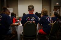 Surviving family members seated at tables.