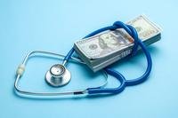 Cash and stethoscope.