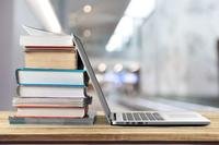 Textbooks and an open laptop