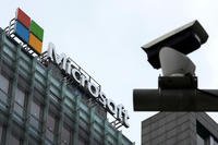 A security surveillance camera is seen near the Microsoft office building in Beijing