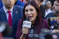 Right-wing activist Laura Loomer is in front of the courthouse where the hush-money trial of Donald Trump got underway Monday, April 15, 2024, in New York. (AP Photo/Ted Shaffrey)