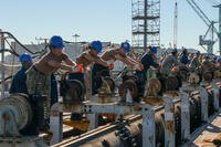 Sailors participate in the installation of a catapult aboard the Nimitz-class aircraft carrier USS John C. Stennis (CVN 74) in Newport News, Virginia, Oct. 7, 2025. (U.S. Navy photo by Mass Communication Specialist Seaman Mekhi Manson)