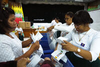 Officials prepare to count votes at a polling station in Naypyitaw, Myanmar.