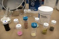 Containers of fentanyl pills are displayed at a Drug Enforcement Administration (DEA) research laboratory on Tuesday, April 29, 2025, in Northern Virginia. (AP Photo/Mark Schiefelbein)