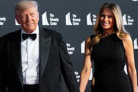 Donald Trump and Melania Trump walk the red carpet at the John F. Kennedy Center for the Performing Arts.