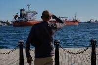 A person watches the oil tanker Ocean Mariner, Monrovia, arrive to the bay in Havana, Cuba.