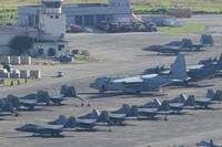 U.S. military aircraft are parked on the tarmac at the airport in Ceiba, Puerto Rico.