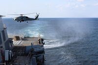An MH-60R Sea Hawk, assigned to Helicopter Maritime Strike Squadron (HSM) 79, departs from the flight deck of the Arleigh Burke-class guided-missile destroyer USS Roosevelt (DDG 80) during a Strait of Hormuz transit. (U.S. Navy photo by Mass Communication Specialist 1st Class Indra Beaufort)
